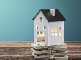 Home Model on Cash Blue Background Home Refinance-2-1